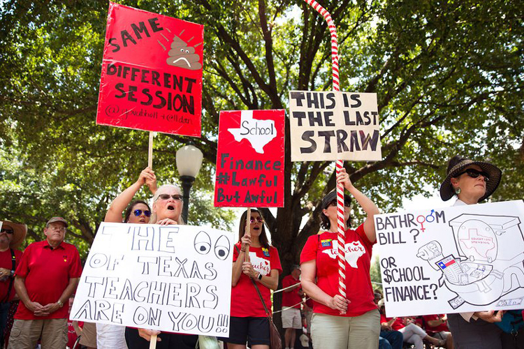 Educationors and supporters with signs in Gordon, Texas during Education Rally