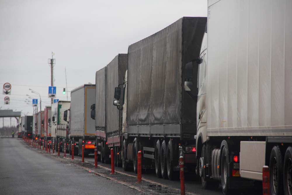 Truck inspection - a long congestion traffic of many trucks with