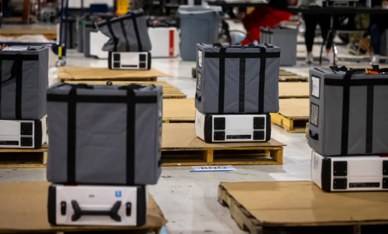 Ballot bags are piled over their corresponding voting machines at the Elections Technology Center in Harris County on election night on March 1, 2022. Credit: Annie Mulligan