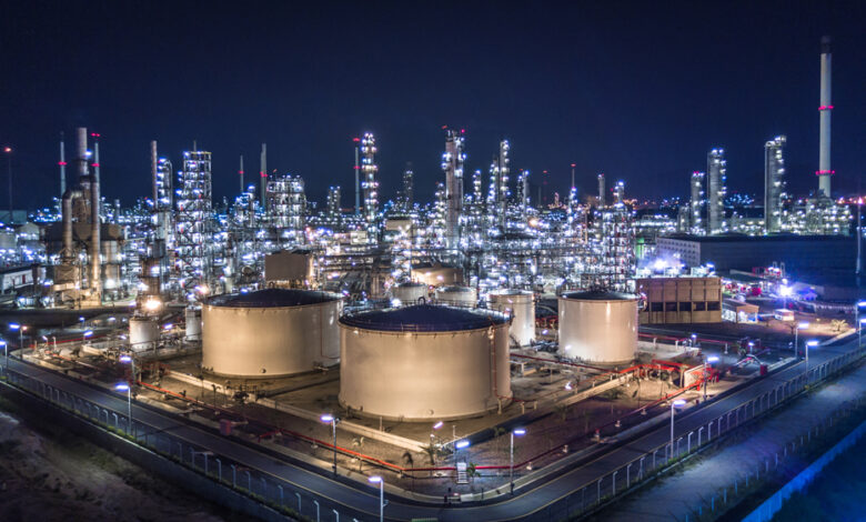 Aerial view of large oil refinery and storage tanks